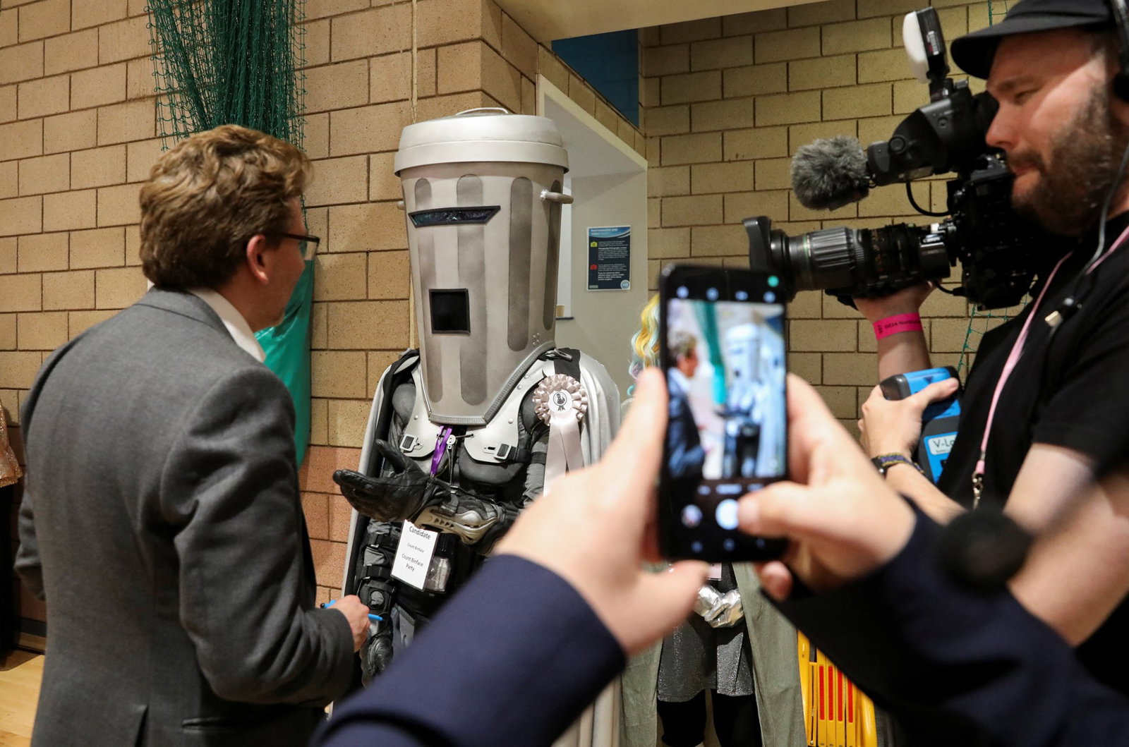 Man with bin over his head